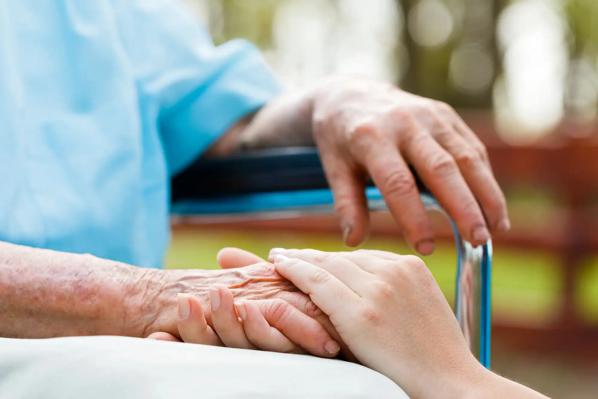 close up of hand holding in an assisted living in Chicago