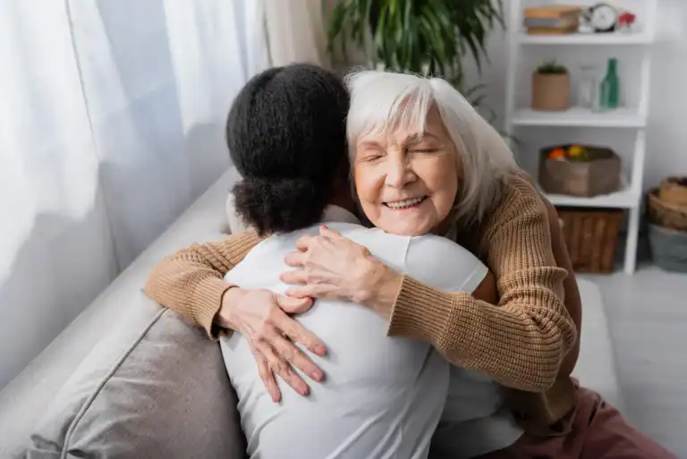 women hugging at a senior living in Chicago